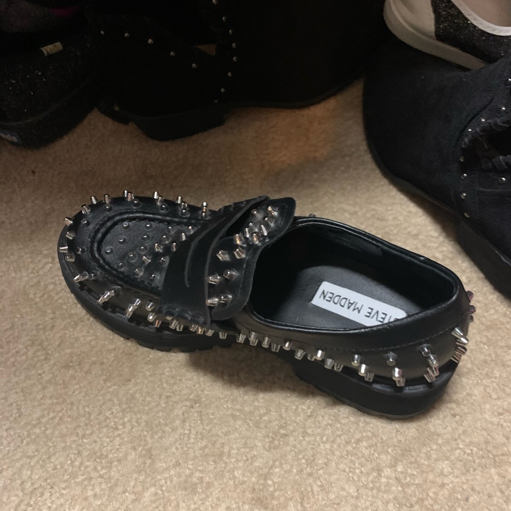 Steve Madden spiked boots.